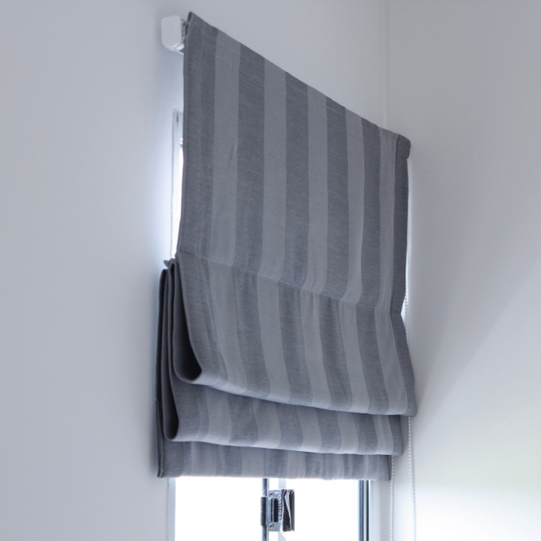 striped roman blinds with a cascade finish